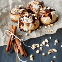 cinnamon rolls with cinnamon sticks in a rustic style
