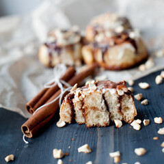 cinnamon rolls with cinnamon sticks in a rustic style