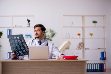 Young male doctor radiologist working in the clinic