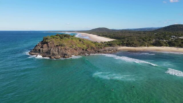 Aerial View Of People Surfing At Blue Ocean In Summer - Surfing At Cabarita Beach With Norries Headland.