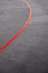 red curved line on asphalt