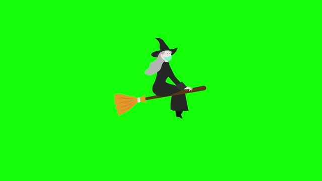 Spooky witch flying with broomstick in the studio