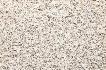 Beige granite texture background. Close-up of granite surface.