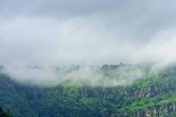 mountains with clouds in a tropical forest