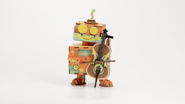 Robotime Little Performer DIY Music Box. Assembly Of Do-It-Yourself Wooden Robot With Violin And Hand Crank. stop motion