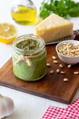 Italian pesto sauce on a wooden background. National kitchen. Healthy eating. Vegetarian food.
