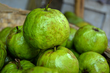 A stacking of fresh tropical green guava. Accumulated green guava for nutrition and good health