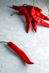 red hot chili pepper on a plastered surface close-up