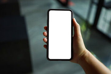 Women's hands holding cell telephone blank copy space screen. smart phone with technology concept