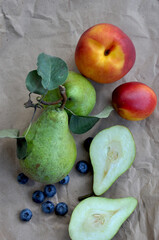 Fresh fruits pear, nectarine, peach and blueberry. Autumn harvest. Winter pear variety. Anthocyanins