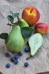 Fresh fruits pear, nectarine, peach and blueberry. Autumn harvest. Winter pear variety. Anthocyanins