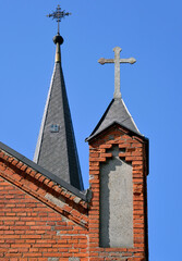 General view and architectural details of the Catholic Church of the Exaltation of the Holy Cross built in 1861 in the neo-Gothic style in the city of Olecko in Masuria, Poland.