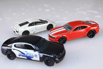 Obraz na płótnie Canvas A diecast model of muscle cars and supercars