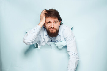 bearded man breaks through the background fun isolated background