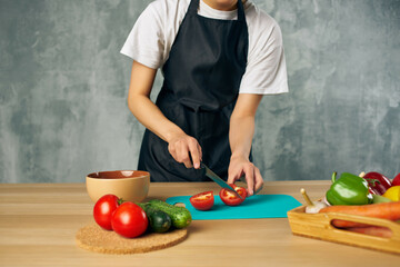 Cook in black apron Cooking healthy eating salad diet