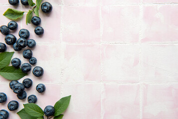 Blueberries on tile background