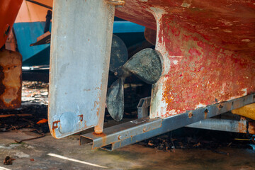 Fototapeta na wymiar Small fishing boat wreck in a ship yard