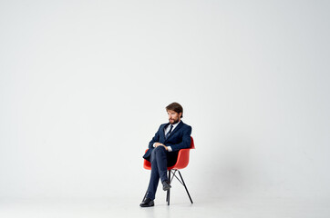 business man sitting on red chair work manager office