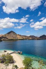 Exotic island and gazebo on the beach with seascape and hills