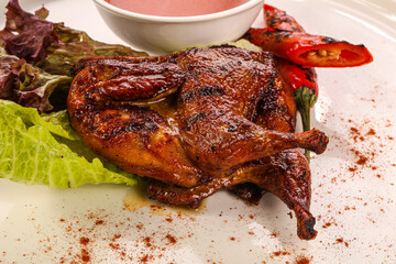 Roasted quail with tomato sauce
