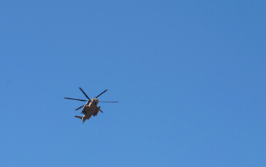 Naklejka na ściany i meble helicopter flying in sky