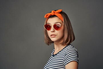 woman wearing sunglasses with striped t-shirt fashion summer style cropped view