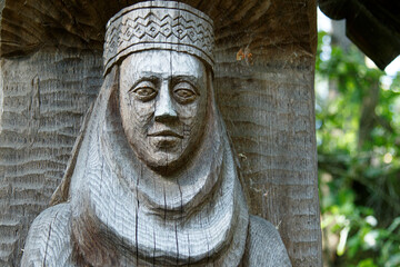 A statue of a woman hollowed out in a tree. Handmade 