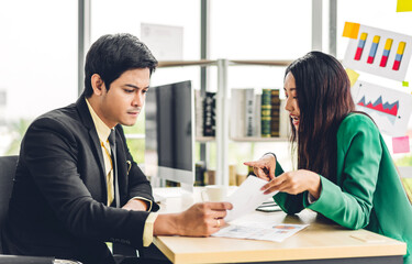 Successful of two asian business people meeting and discussing strategy with new startup project.Creative business people planning and brainstorm in modern office.Teamwork concept