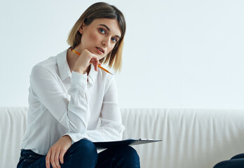 Business woman sitting on sofa work documents office