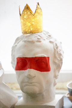 Caesar plaster head with red stripe on the eyes.