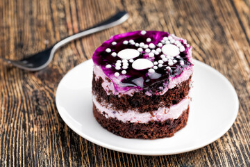 blueberry-flavored cake covered with blueberry jam
