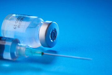 vaccine bottle on the blue background