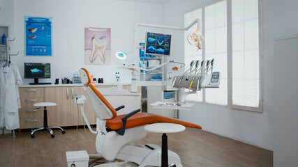 Interior of dentist stomatology orthodontic office with teeth radiography on monitor. Empty dental hospital room with nobody in it prepared for tooth diagnosis. Zoom in shot of medical workplace