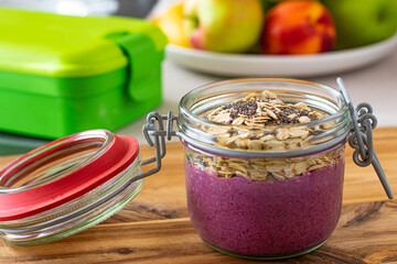Breakfast to go. Blureberry yogurt with oats and chia seeds in a glass jar