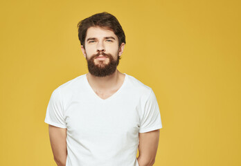 Obraz premium emotional man in a white t-shirt serious look Lifestyle