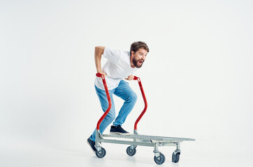bearded man in a white t-shirt transport in a box isolated background
