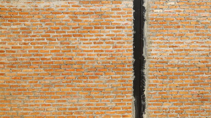 Columns and red brick walls. Red brick wall background with black painted steel columns in between. Selective focus