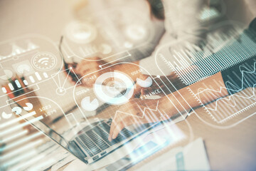 Double exposure of woman hands typing on computer and technology theme drawing. High Tech concept.