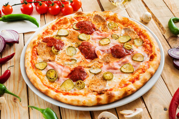 tasty pizza on the wooden background