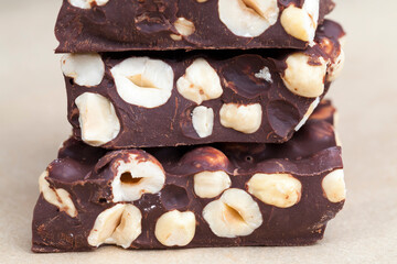 milk chocolate with whole and chunks of hazelnuts