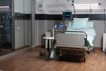 Recovery Room with beds and comfortable medical equipped in a hospital. Clean and empty room with a bed in the new medical center. Iv drip and in modern clinic.