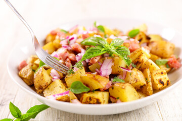 grilled potato with bacon and onion