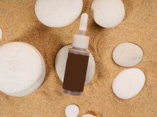 bottles and cans with cosmetics, on zen stones and sand, mockup for design