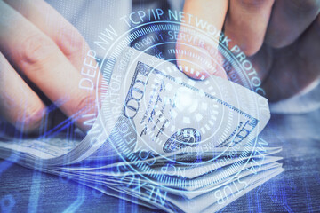 Double exposure of technology drawing hologram and us dollars bills and man hands. Data concept