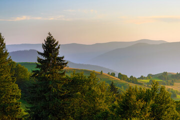 Amazing mountain landscape with colorful vivid sunset on the cloudy sky