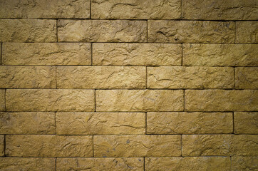 Yellow bricks pattern on wall for abstract background. Copy space.
