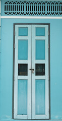 Obraz premium House with a retro blue wooden door, Chinese style.