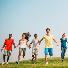 Fototapeta premium Diverse young people holding hands