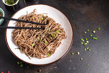 buckwheat noodles soba fresh portion ready to eat meal snack on the table copy space food background rustic. top view keto or paleo diet veggie vegan or vegetarian food