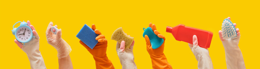general cleaning and cleaning service concept, hands in rubber gloves hold cleaning tools